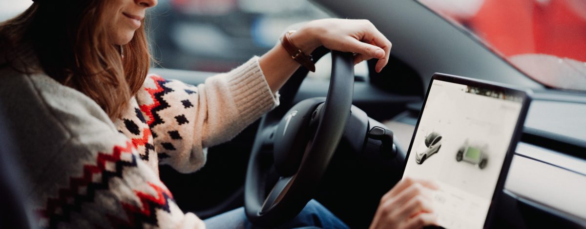 Woman operating an electric car