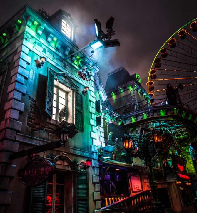 a haunted house decorated and lit up for halloween