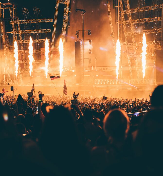 people in the crowd at a gig, looking at the stage