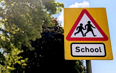 street signage showing school nearby