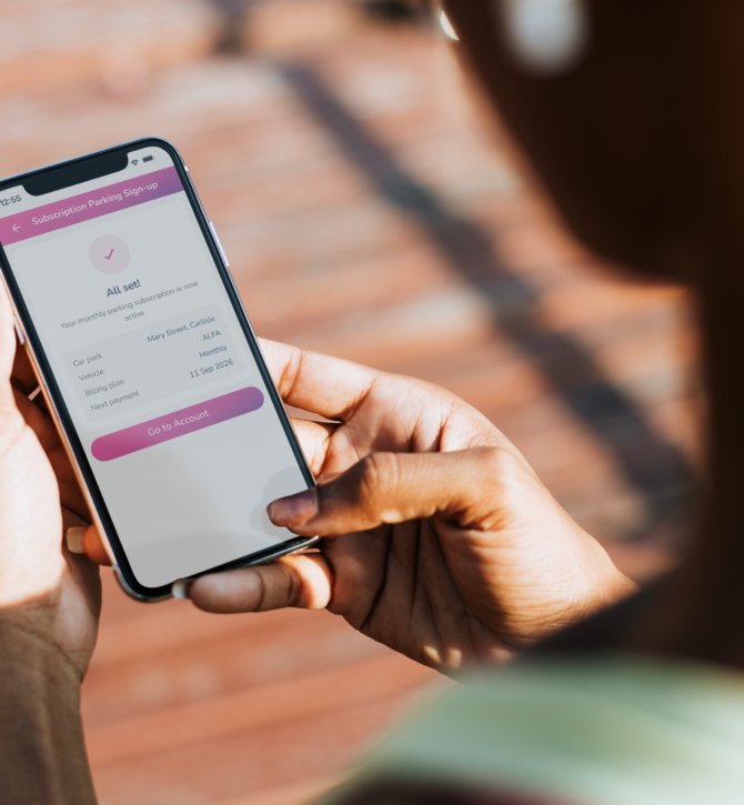 Mobile in Hand with Evology subscription parking sign up screen
